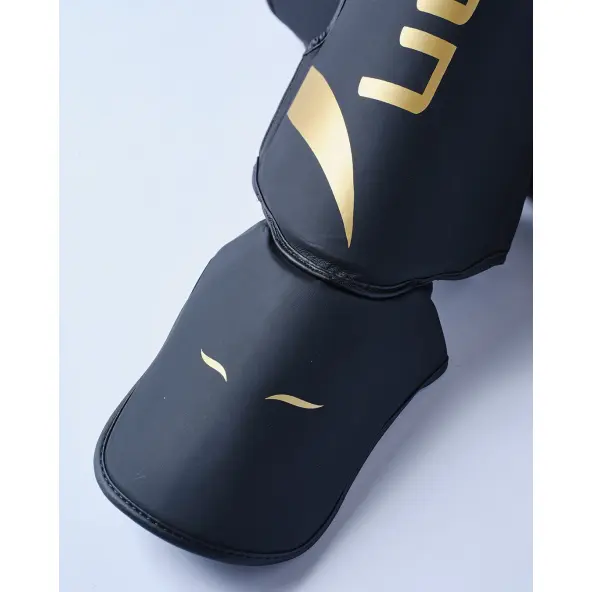 Protège-tibias et pieds Elion Extravagant Noir/Or